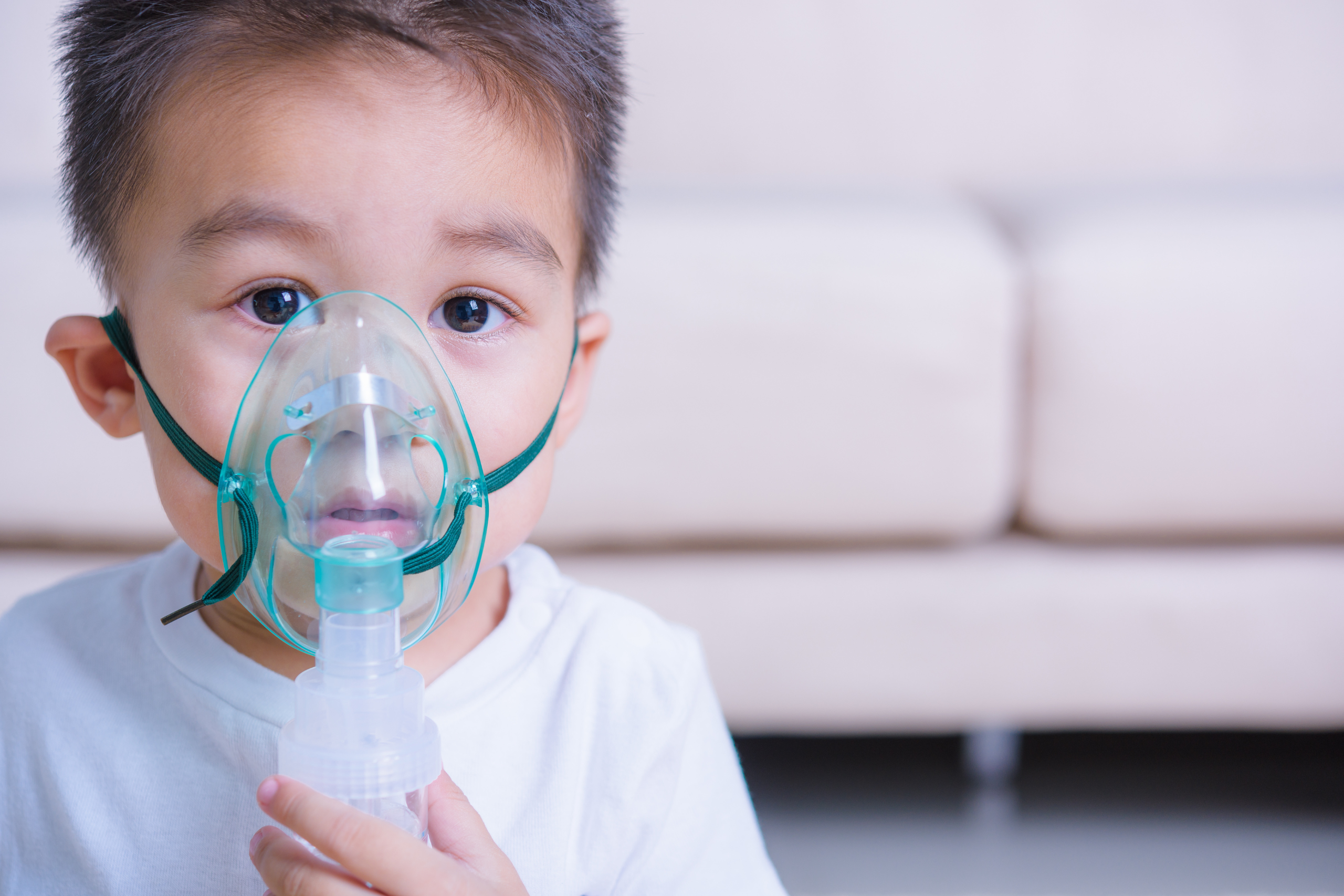child using nebulizer