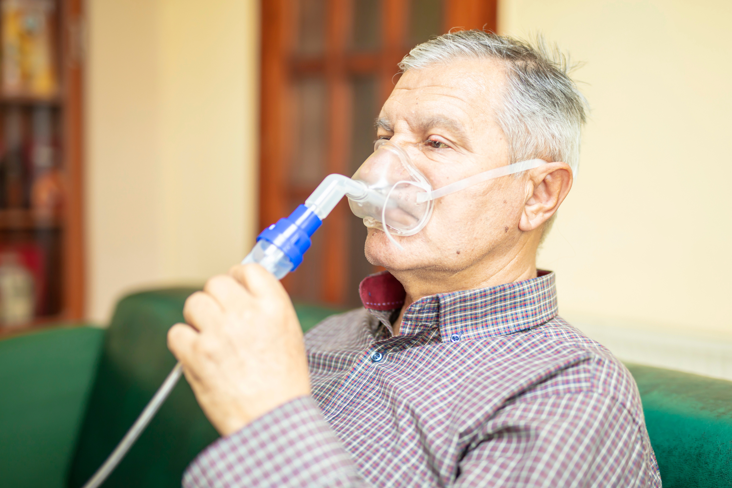 man using nebulizer