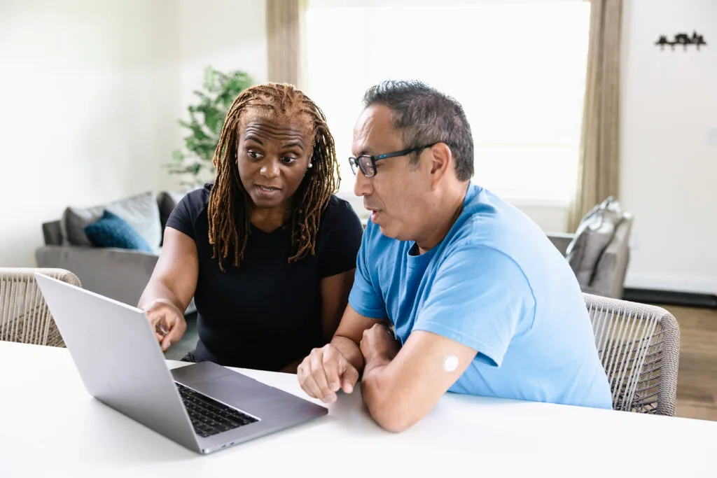 Woman and man looking at computer