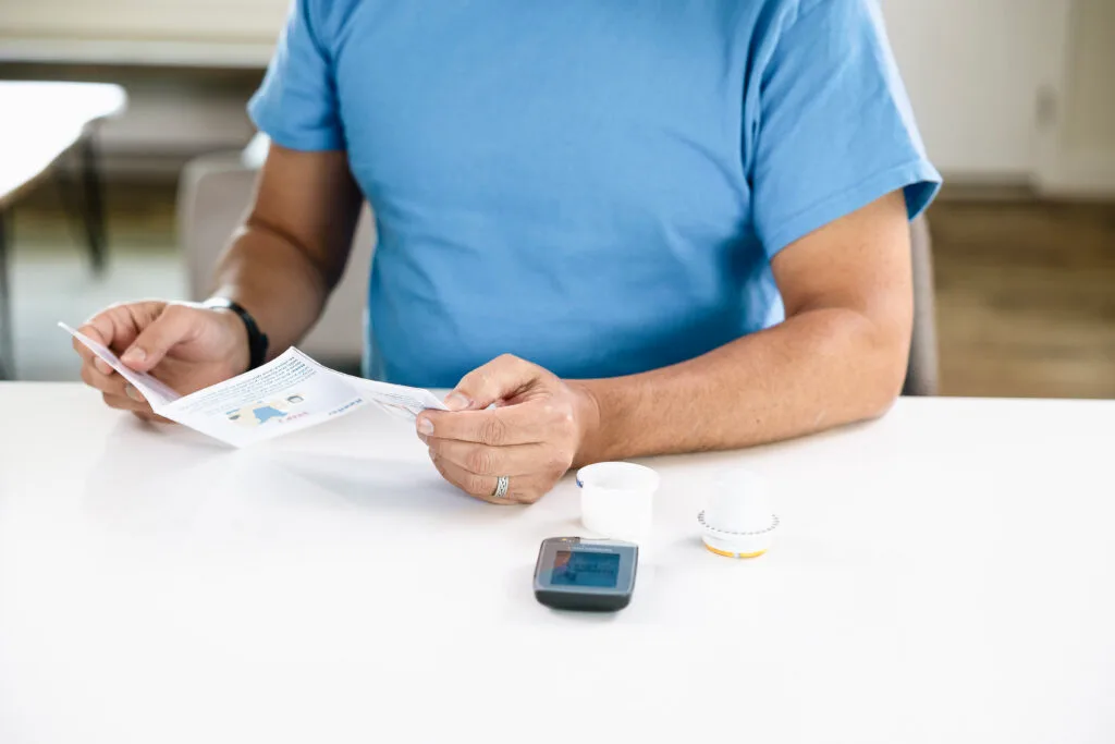 man reviewing cgm literature