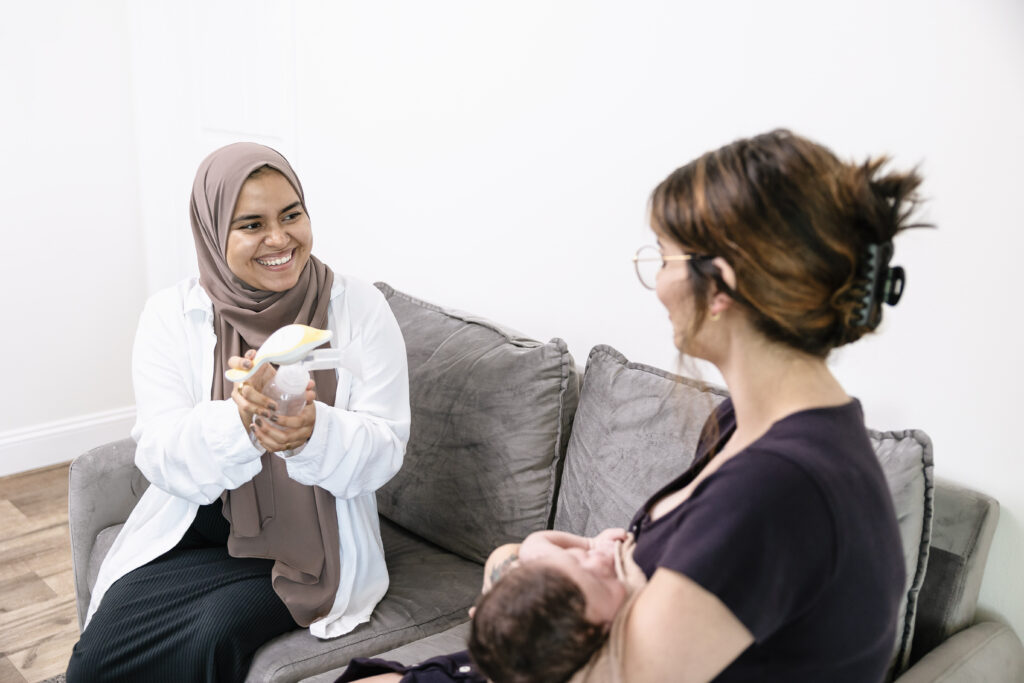 Lactation consultant with mother and baby