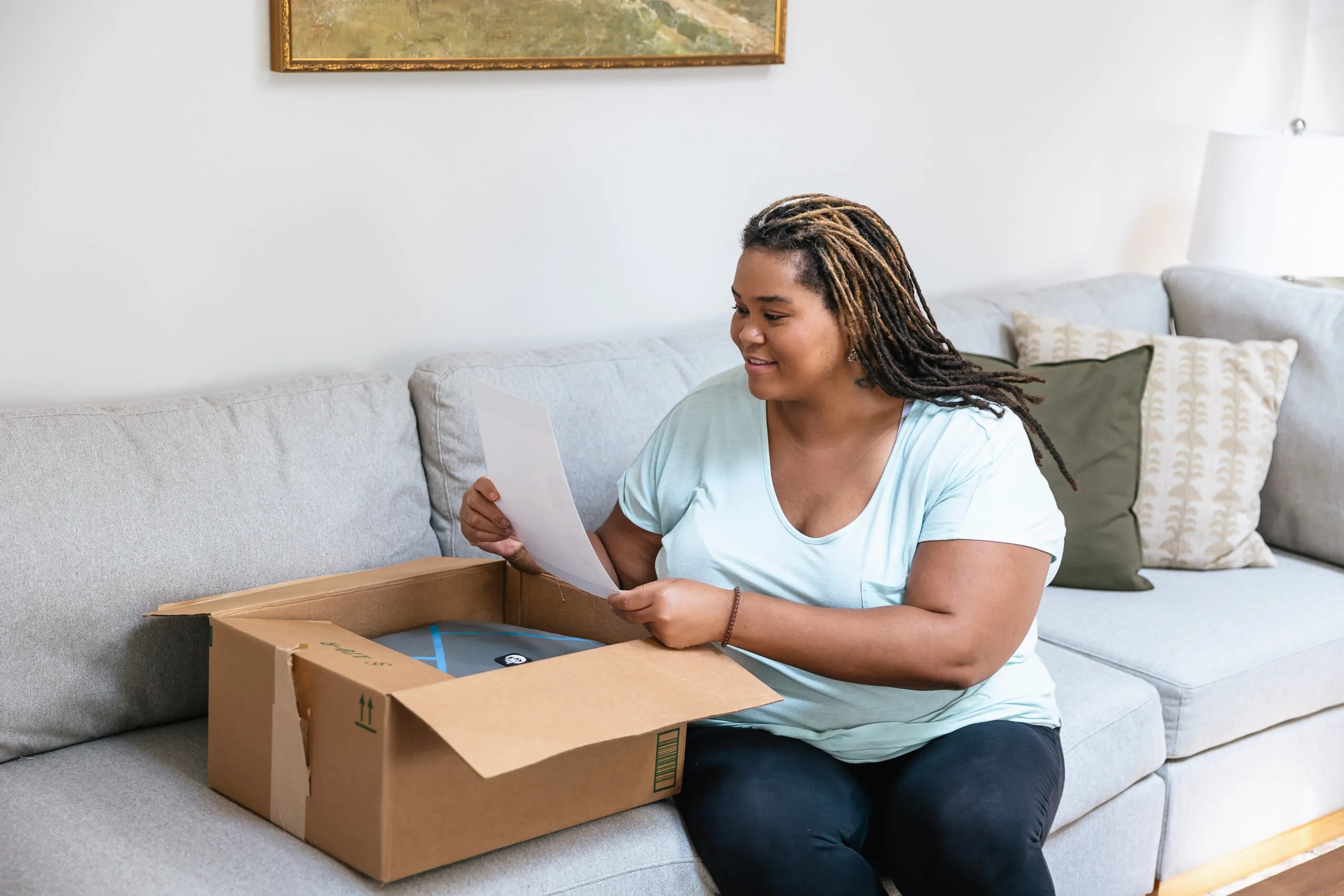 Woman opening box