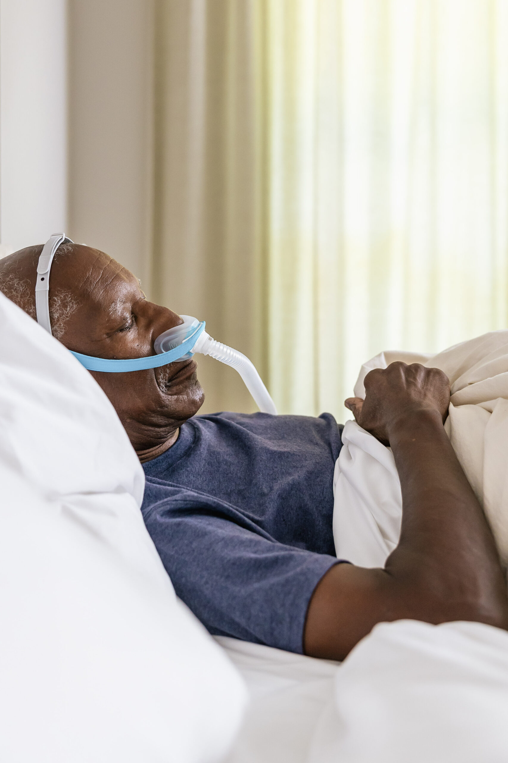 Man asleep with cpap mask