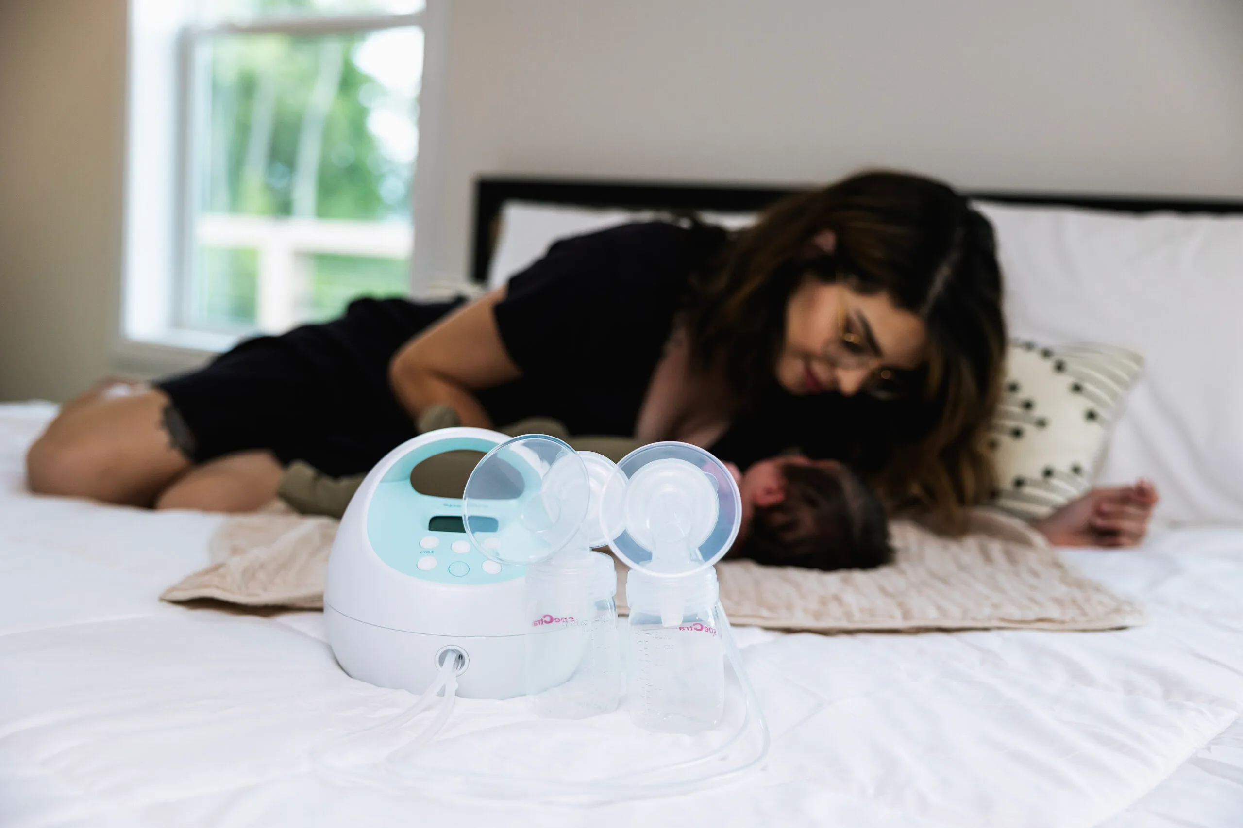 Mother and child with breast pump