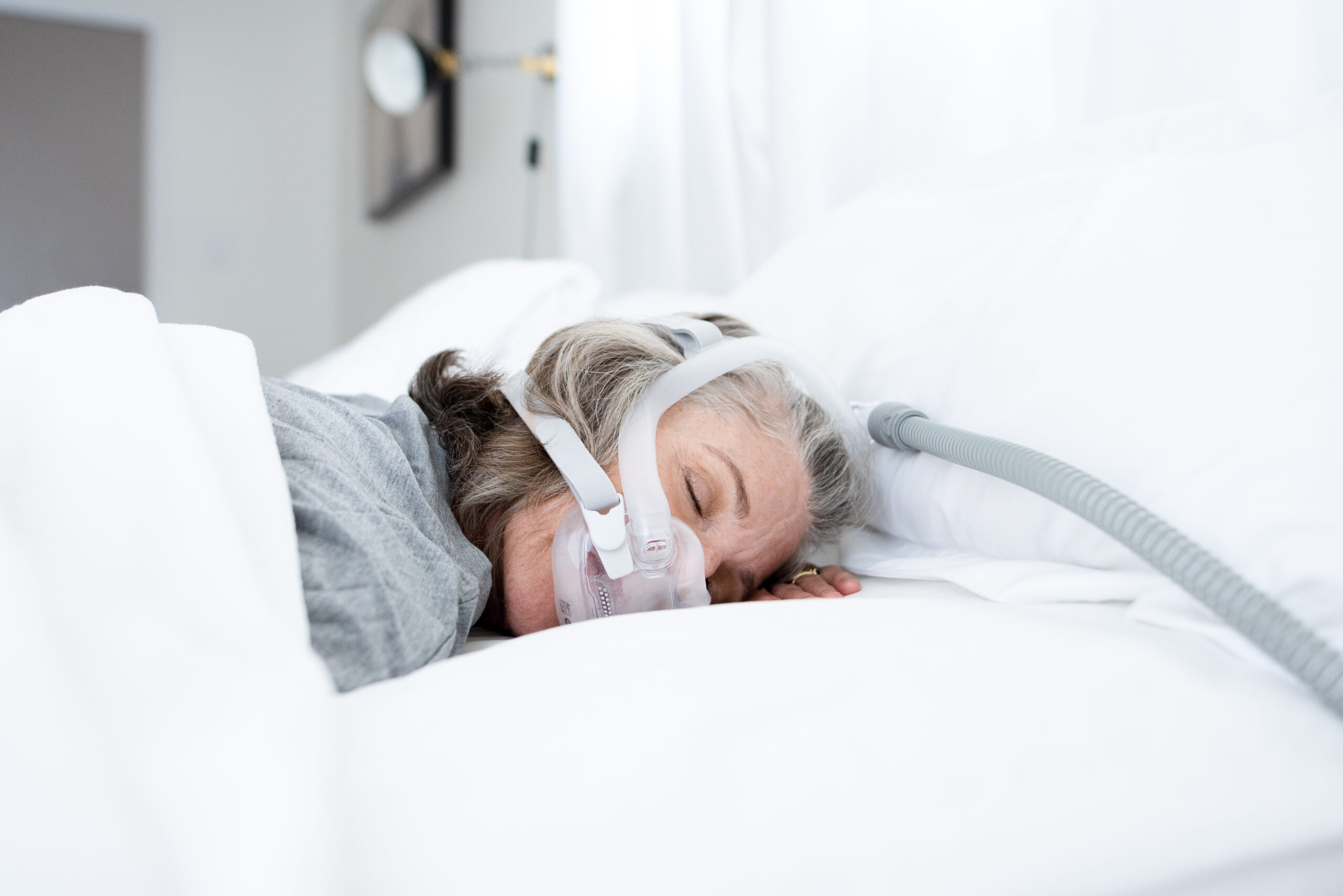 Woman asleep with cpap mask on