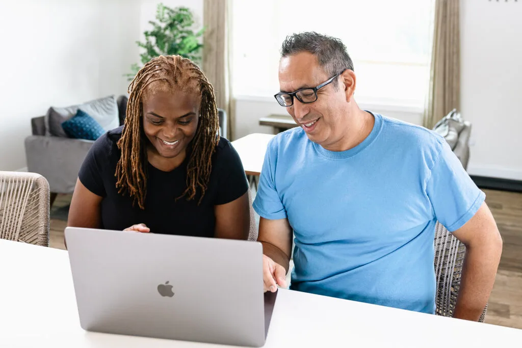 Man and women looking at computer