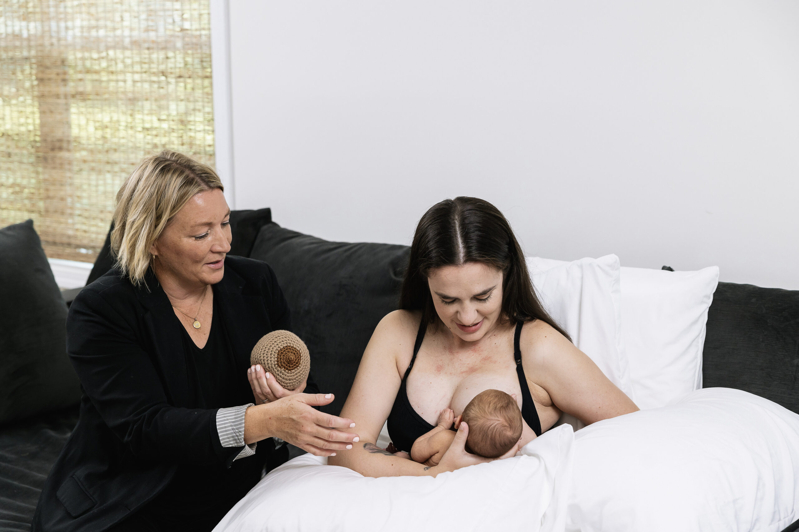 A woman consulting a mother on lactation