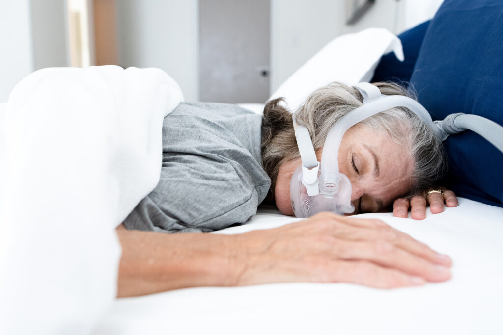 Woman sleep with pap mask