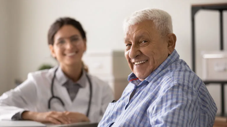 Image of smiling doctor and patient because of Improvement in healthcare quality