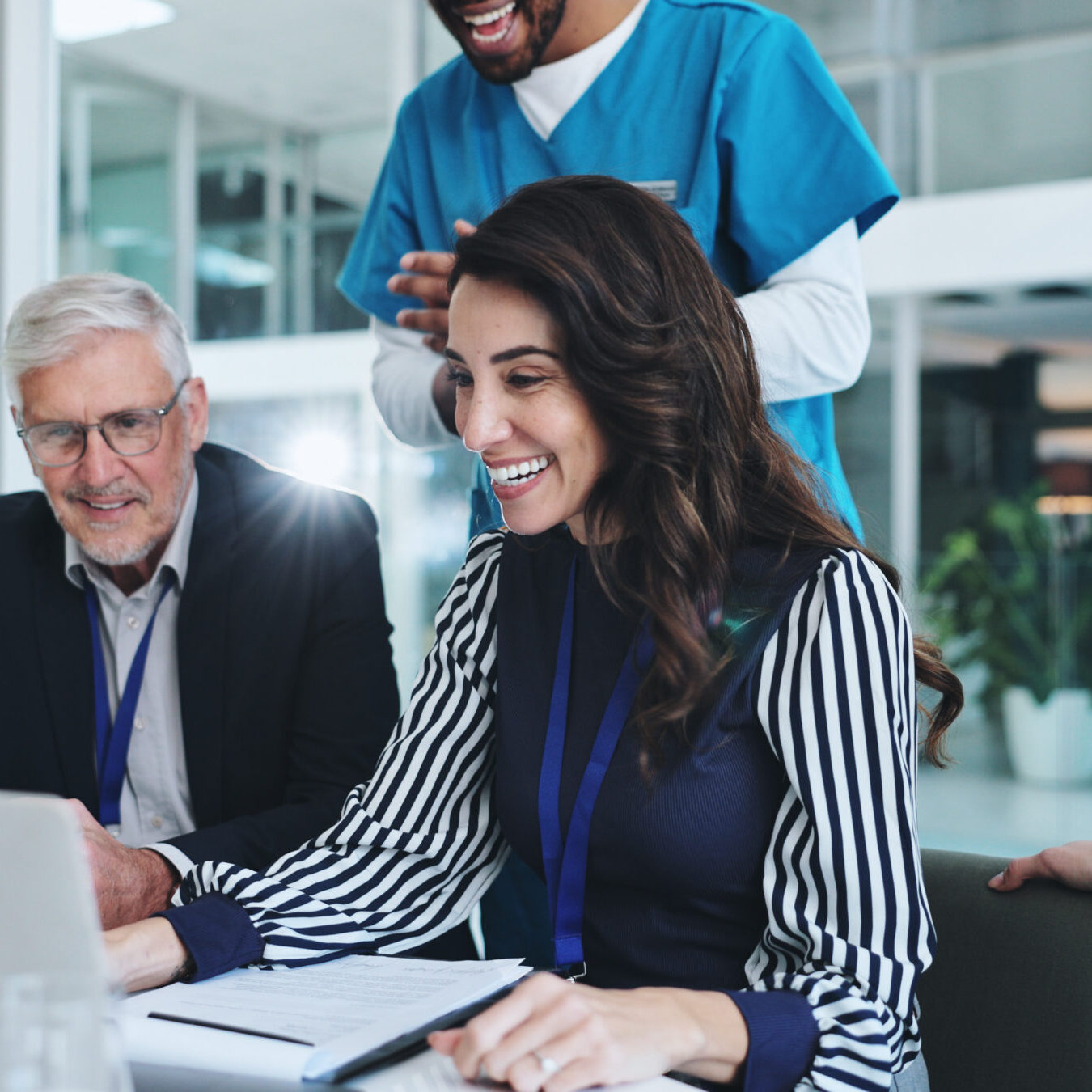 People, medical team and laptop for video call, advice and discussion for surgery or patient records. Doctor, technology and professional opinion for help, results and health in clinic or hospital.