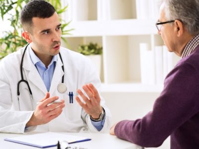 urology-feature Doctor conversing with patient
